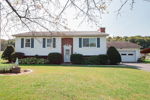 view of front facade with a garage and a front lawn