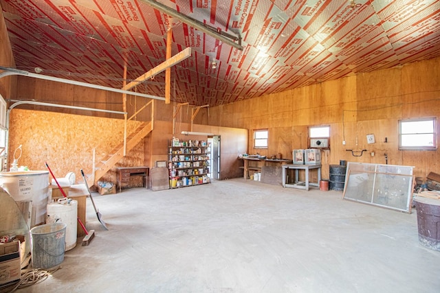 garage featuring wooden walls