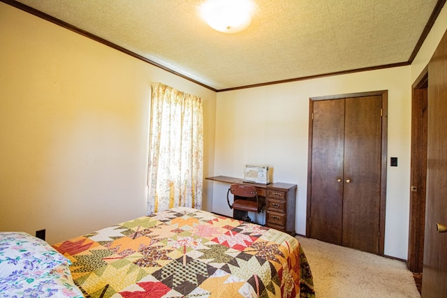 carpeted bedroom featuring ornamental molding and a closet