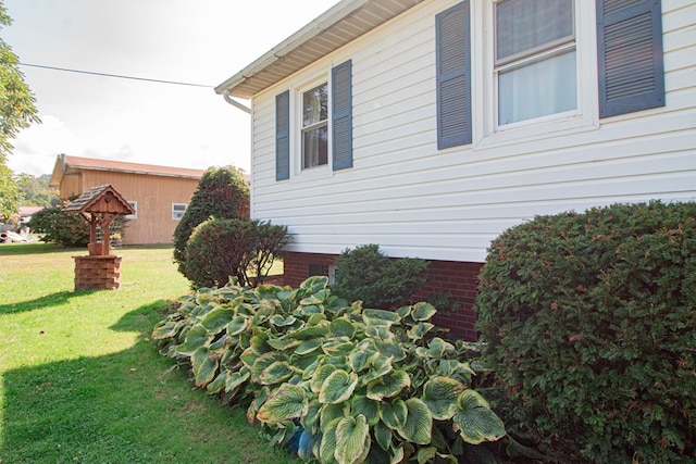 view of property exterior featuring a lawn