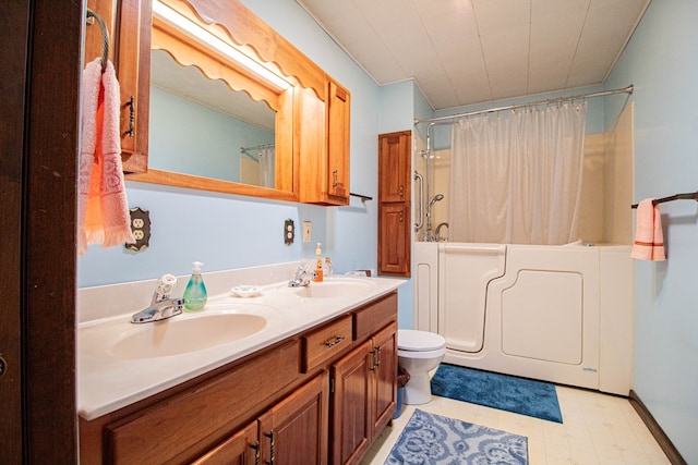 full bathroom featuring shower / bath combination with curtain, vanity, and toilet