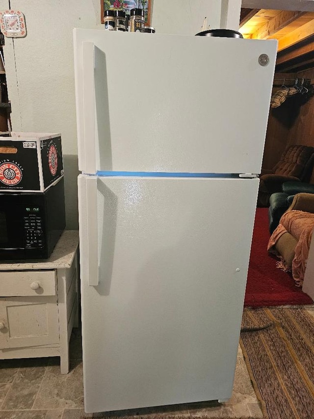 225 Logue Run Rd, Austin, PA 16720 - kitchen featuring freestanding refrigerator and stone finish flooring
