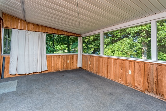 unfurnished sunroom with vaulted ceiling