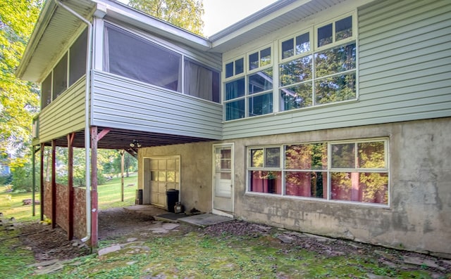 back of property featuring a sunroom