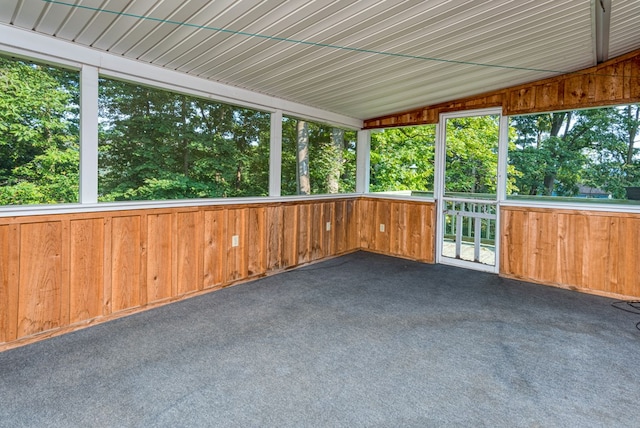 unfurnished sunroom with vaulted ceiling