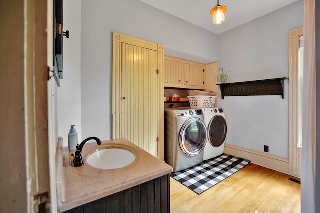 1349 Hills Creek Rd, Wellsboro, PA 16901 - laundry area with independent washer and dryer, cabinet space, and light wood-type flooring
