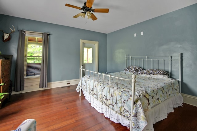 1349 Hills Creek Rd, Wellsboro, PA 16901 - bedroom with multiple windows, wood finished floors, baseboards, and ceiling fan