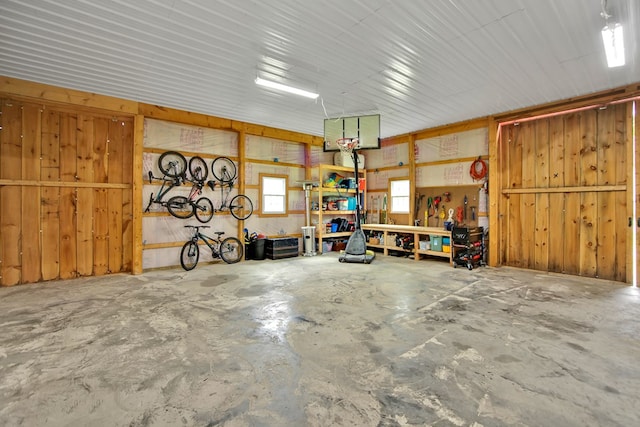 1349 Hills Creek Rd, Wellsboro, PA 16901 - garage featuring a workshop area and wood walls