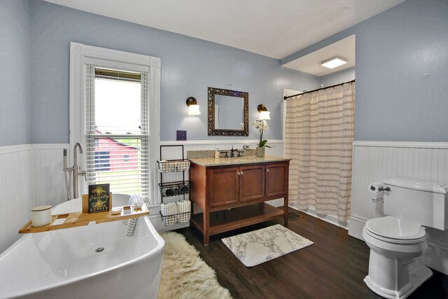 1349 Hills Creek Rd, Wellsboro, PA 16901 - bathroom featuring wainscoting, wood finished floors, toilet, a freestanding tub, and vanity