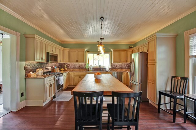 1349 Hills Creek Rd, Wellsboro, PA 16901 - kitchen featuring stainless steel appliances, healthy amount of natural light, a sink, ornamental molding, and dark wood-style floors