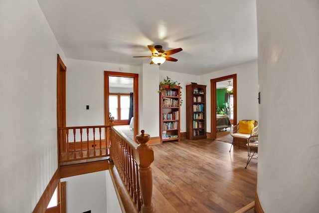 1349 Hills Creek Rd, Wellsboro, PA 16901 - living area featuring a ceiling fan, wood finished floors, an upstairs landing, and baseboards