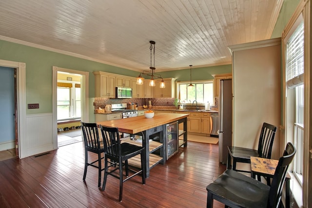 1349 Hills Creek Rd, Wellsboro, PA 16901 - dining area with crown molding, wainscoting, and dark wood-style floors