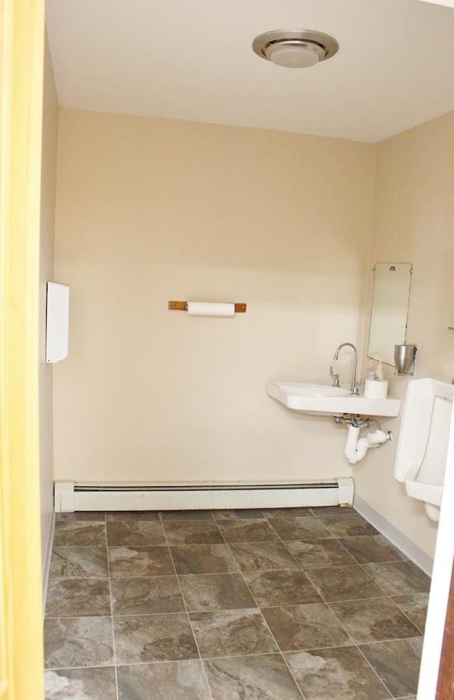 bathroom with sink and a baseboard radiator