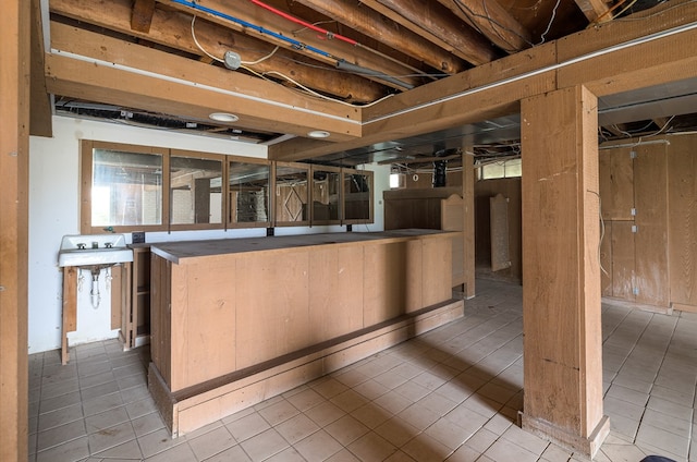 basement with tile patterned floors