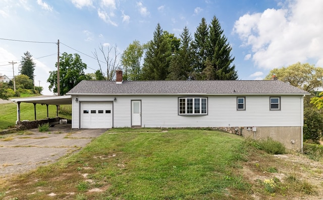 view of front of home with a front lawn, a garage, and a carport