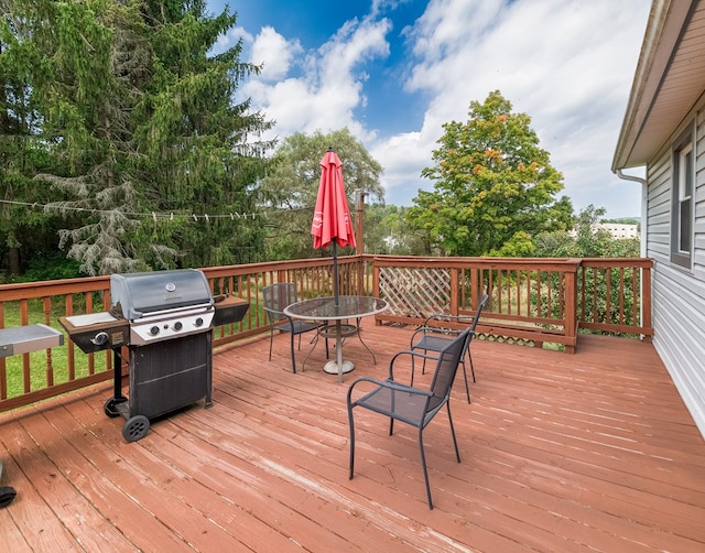 wooden terrace featuring grilling area