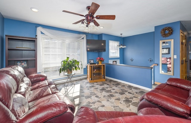 living room featuring ceiling fan and baseboard heating