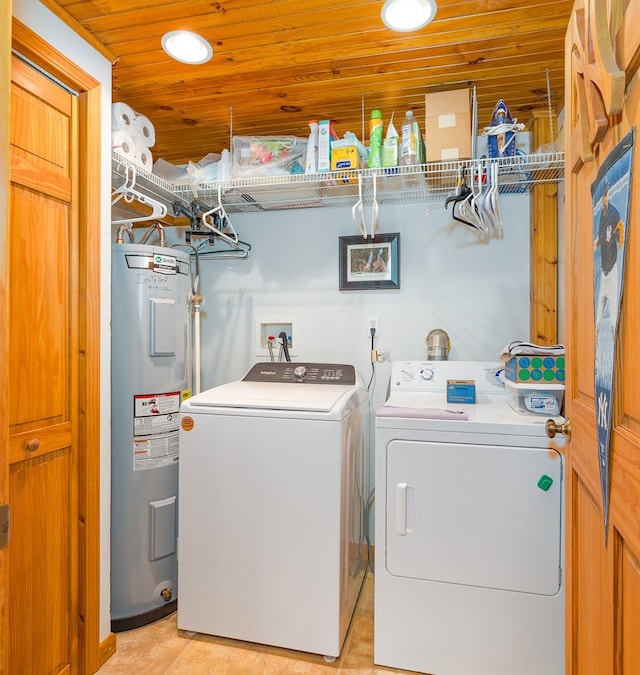 laundry area featuring wooden ceiling, water heater, and washing machine and dryer