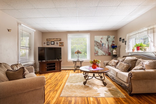 5 Eberenz St, Wellsboro, PA 16901 - living room with baseboard heating, wood finished floors, and a baseboard heating unit
