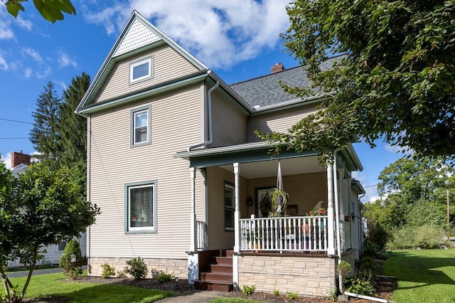 5 Eberenz St, Wellsboro, PA 16901 - victorian-style house featuring covered porch, a front lawn, and roof with shingles