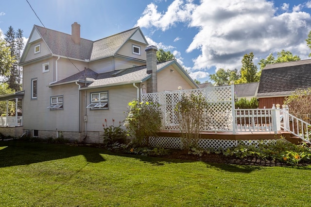 5 Eberenz St, Wellsboro, PA 16901 - back of property with a lawn, a chimney, a wooden deck, and roof with shingles