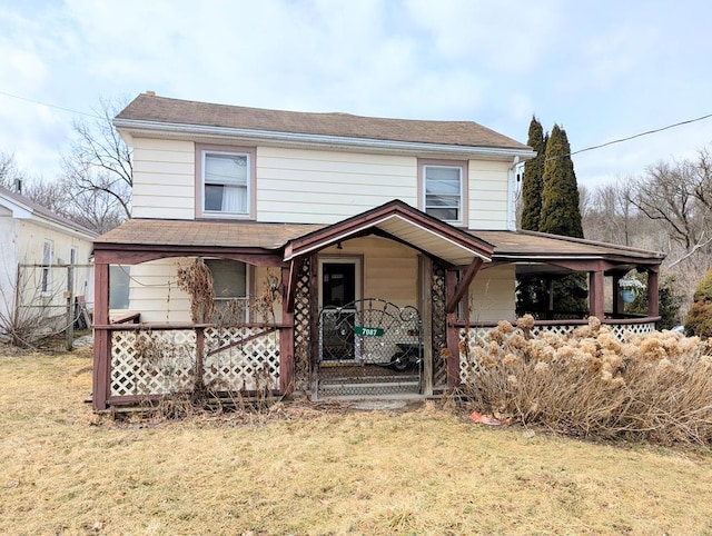 view of front of property featuring a porch and a front yard