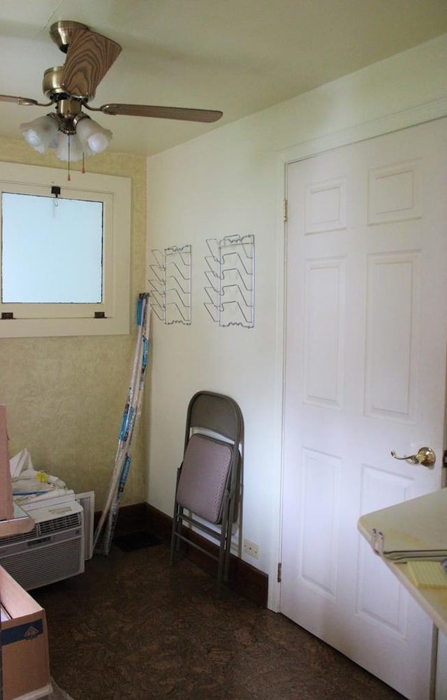 bedroom featuring baseboards and a ceiling fan