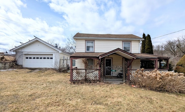 view of front of home with a garage, covered porch, and a front lawn