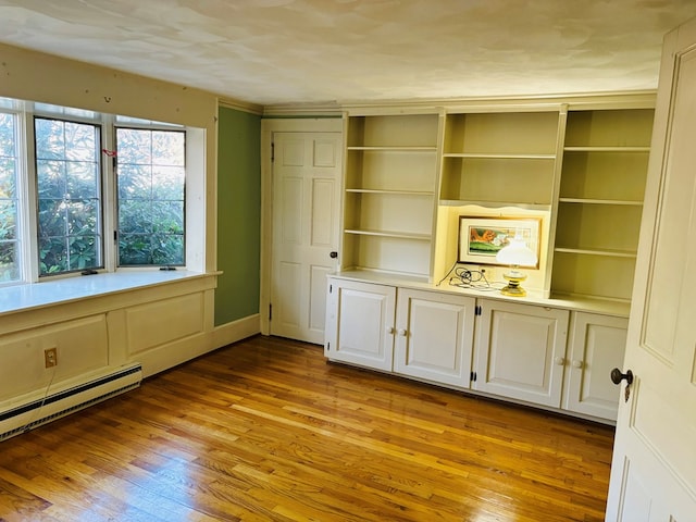 interior space with a baseboard heating unit