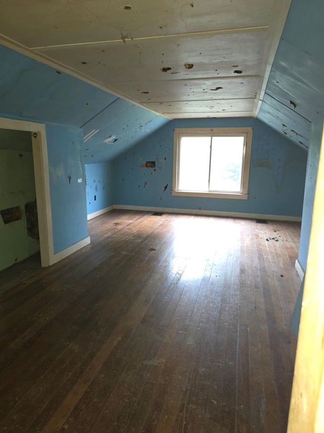 118 Wilbur St, Waverly, NY 14892 - additional living space with wood-type flooring, vaulted ceiling, and baseboards