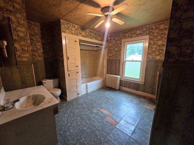 118 Wilbur St, Waverly, NY 14892 - full bath featuring radiator, toilet, wainscoting, vanity, and ceiling fan