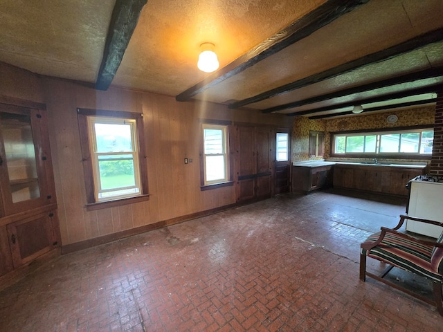 118 Wilbur St, Waverly, NY 14892 - kitchen with brick patterned flooring, beamed ceiling, and baseboards