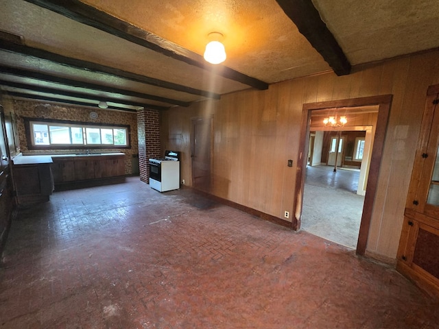 118 Wilbur St, Waverly, NY 14892 - spare room with beam ceiling, wooden walls, and baseboards