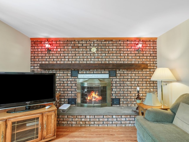 1817 Cotton Hollow Rd, Athens, PA 18810 - living area featuring a brick fireplace and wood finished floors