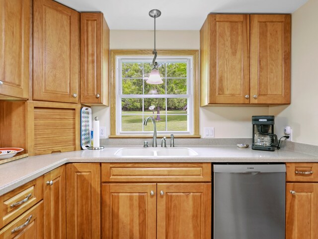 1817 Cotton Hollow Rd, Athens, PA 18810 - kitchen featuring stainless steel dishwasher, a sink, brown cabinets, light countertops, and pendant lighting