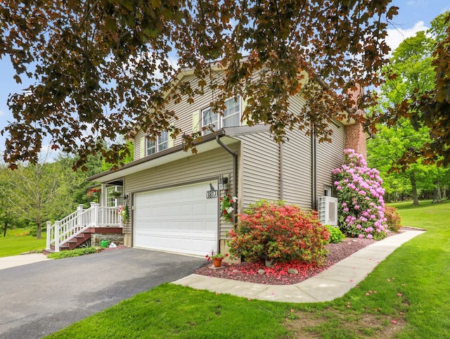 1817 Cotton Hollow Rd, Athens, PA 18810 - view of property exterior with driveway, a yard, an attached garage, and central AC unit