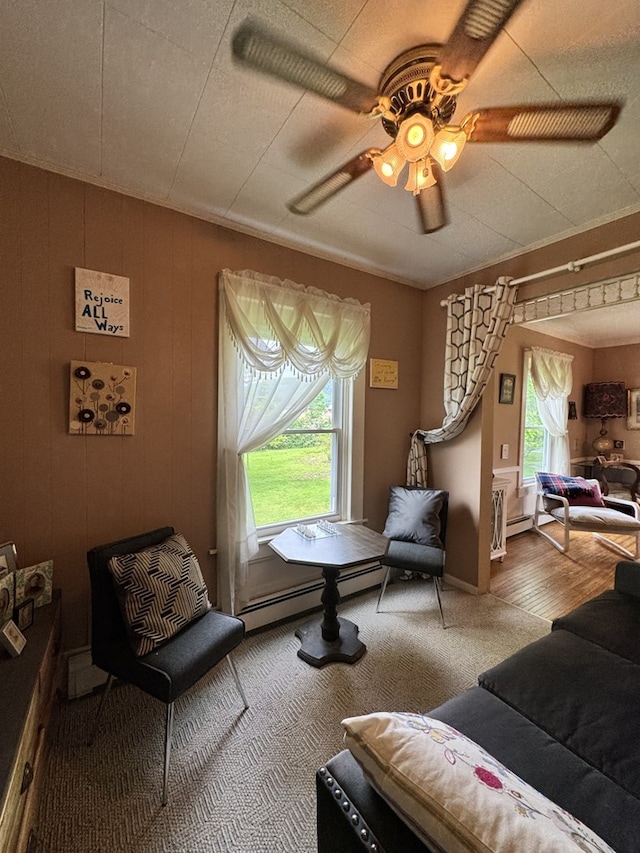66 Benton St, Port Allegany, PA 16743 - carpeted living area featuring a baseboard radiator and ceiling fan