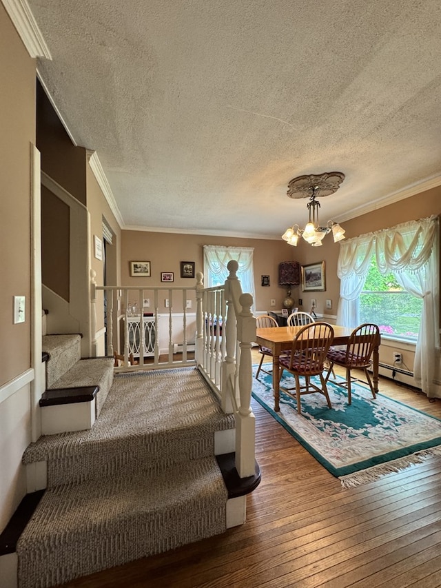 66 Benton St, Port Allegany, PA 16743 - dining room featuring a textured ceiling, ornamental molding, wood-type flooring, a chandelier, and stairs