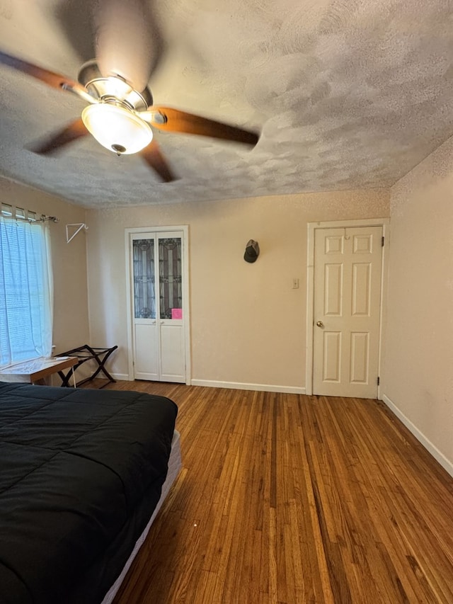 66 Benton St, Port Allegany, PA 16743 - bedroom with wood finished floors, a textured ceiling, and a ceiling fan