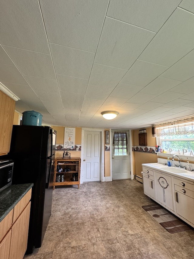 66 Benton St, Port Allegany, PA 16743 - kitchen with freestanding refrigerator and a baseboard radiator