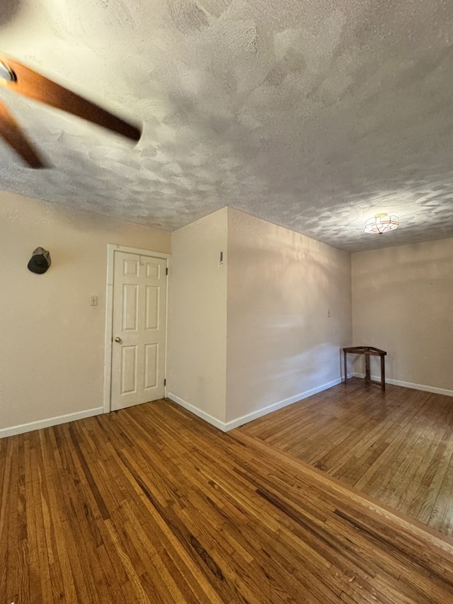66 Benton St, Port Allegany, PA 16743 - empty room featuring wood-type flooring and a textured ceiling