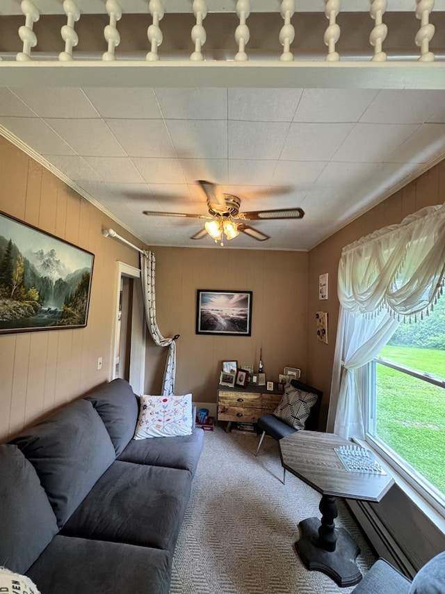 66 Benton St, Port Allegany, PA 16743 - living area with carpet flooring, crown molding, a baseboard radiator, wooden walls, and ceiling fan