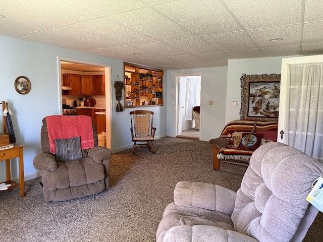 carpeted living room with baseboards