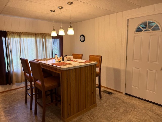 dining space featuring visible vents and tile patterned floors