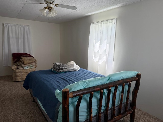 carpeted bedroom featuring a ceiling fan