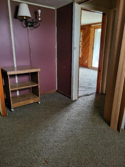 interior space featuring dark colored carpet