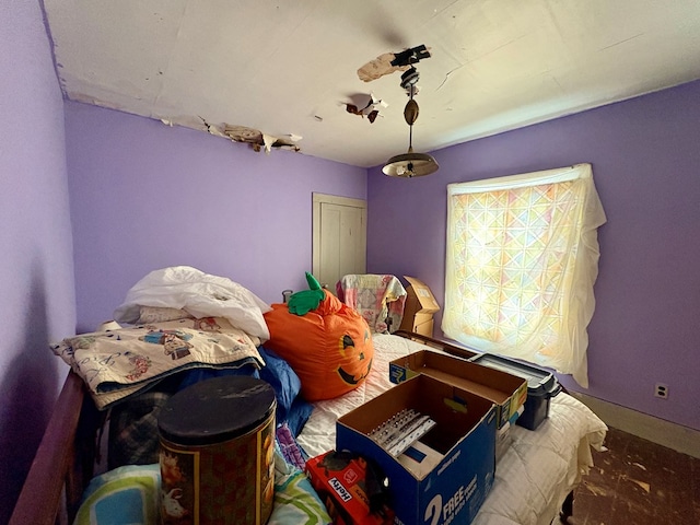 bedroom featuring baseboards