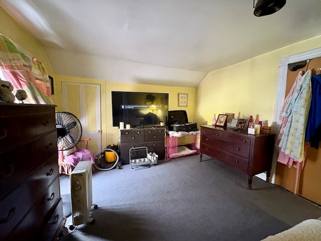 bedroom with carpet flooring and vaulted ceiling