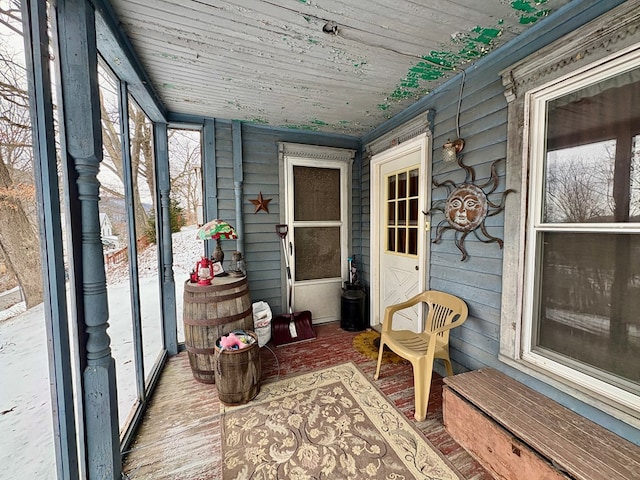 sunroom featuring wooden ceiling