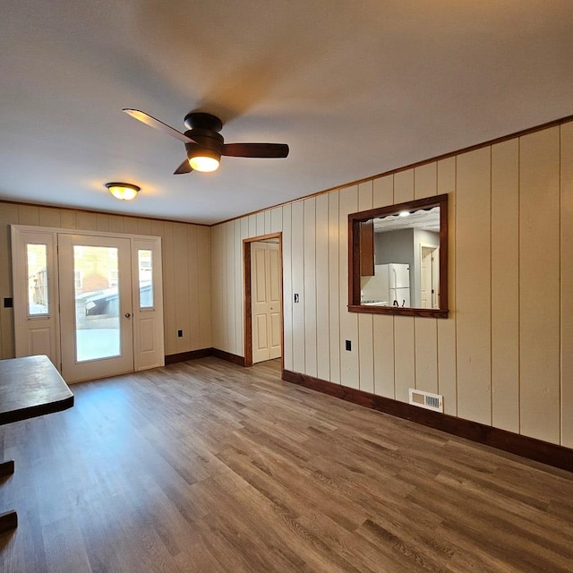 interior space featuring hardwood / wood-style floors and ceiling fan